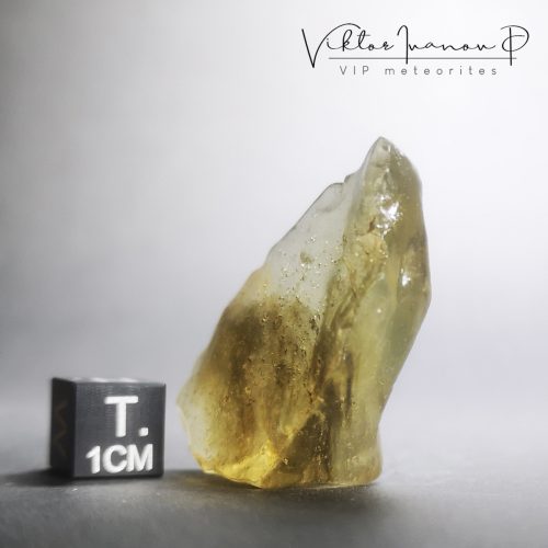 Libyan Desert Glass (LDG). Gem quality with dark inclusions.